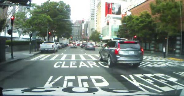 An Uber self-driving SUV, self-driving like a jerk in downtown SF.